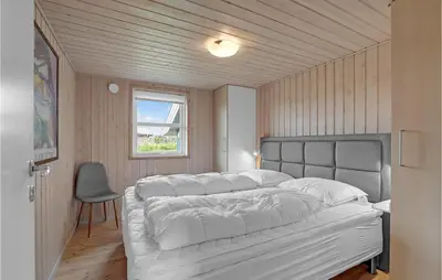 a bedroom with a large white bed and a window at Stunning Home In Lemvig With Wifi in Lemvig