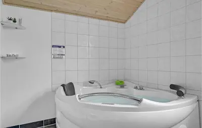 a white bathroom with a sink and a toilet at Stunning Home In Lemvig With Wifi in Lemvig