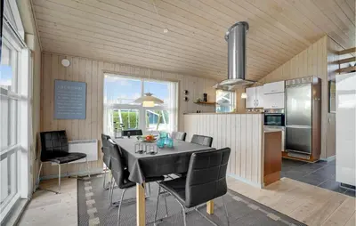 a kitchen and dining room with a table and chairs at Stunning Home In Lemvig With Wifi in Lemvig