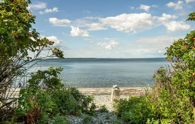 a view of the ocean from the beach at 2 Bedroom Nice Home In Roslev in Roslev