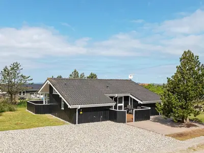 a black house with a black roof at 7 person holiday home in Løgstør-By Traum in Løgsted