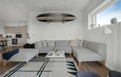 a living room with a couch and a table at Beautiful Home In Thisted With Wifi in Thisted