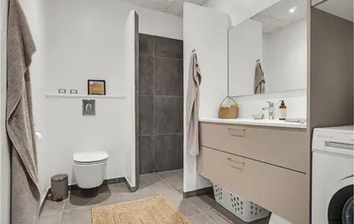 a bathroom with a toilet and a sink at Beautiful Home In Thisted With Wifi in Thisted
