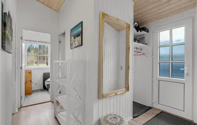 a white room with a mirror and a door at 3 Bedroom Beautiful Home In Højslev in Højslev