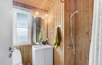 a bathroom with a toilet and a sink and a shower at 3 Bedroom Beautiful Home In Højslev in Højslev