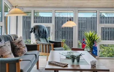 a living room with a couch and a table at 3 Bedroom Beautiful Home In Højslev in Højslev