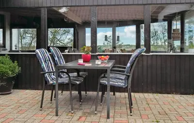 a table and chairs sitting on a patio at Awesome Home In Bedsted Thy With Wifi in Bedsted Thy