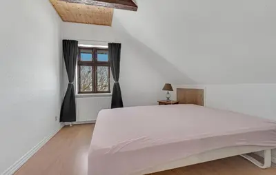 a bedroom with a large white bed and a window at Awesome Home In Bedsted Thy With Wifi in Bedsted Thy
