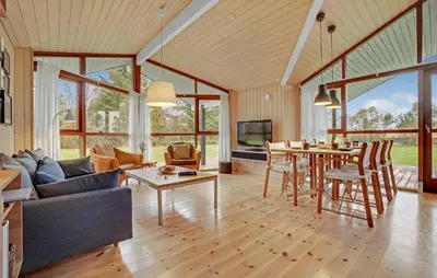 a living room with a couch and a table at Amazing Home In Spøttrup With Kitchen in Spottrup