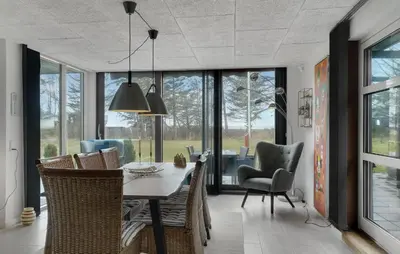 a dining room with a table and chairs at 3 Bedroom Cozy Home In Thyholm in Thyholm