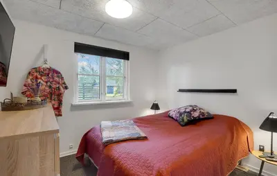 a bedroom with a bed and a window at 3 Bedroom Cozy Home In Thyholm in Thyholm