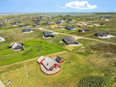 an aerial view of a farm with houses at Holiday Home Beatrice - 150m from the sea by Interhome in Lemvig