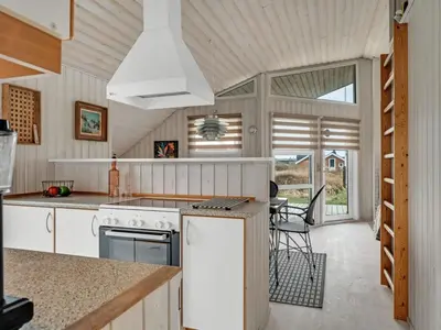 a kitchen with a stove and a counter top at Holiday Home Galmand - 300m from the sea by Interhome in Lemvig