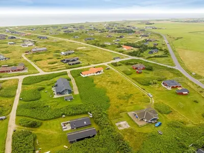 an aerial view of a farm with a group of houses at Holiday Home Kamile - 400m from the sea by Interhome in Harboør
