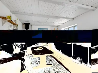 a room with a table and a black and white at Holiday Home Orvo - 150m from the sea by Interhome in Harboør