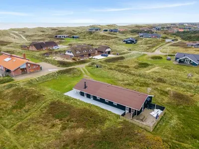 an overhead view of a house in a field at Holiday Home Elnur - 100m from the sea by Interhome in Harboør