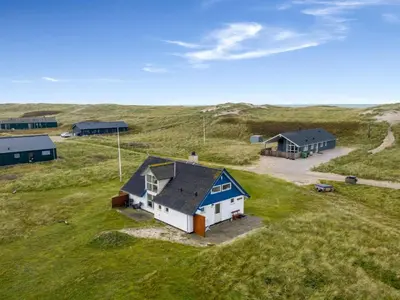 an overhead view of a house in a field at Holiday Home Eringisl - 50m from the sea by Interhome in Harboør