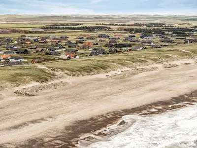 an aerial view of a beach with a group of houses at Holiday Home Kristanna - 150m from the sea by Interhome in Harboør
