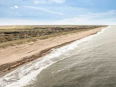 an aerial view of a beach with houses at Holiday Home Kristanna - 150m from the sea by Interhome in Harboør