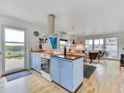a kitchen with a sink and a stove at Holiday Home Thamara - 350m from the sea by Interhome in Harboør
