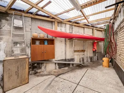 a room with a ladder and a red tent on the wall at Holiday Home Eluisa - 300m from the sea by Interhome in Thyborøn