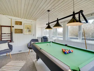 a living room with a pool table in it at Holiday Home Styrmer - 1-2km from the sea by Interhome in Torsted