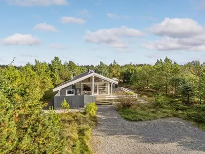 a house in the middle of a forest at Holiday Home Alethe - 1km from the sea by Interhome in Torsted