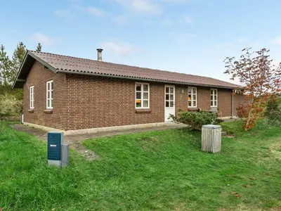 a brick house with a sign in front of it at Holiday Home Thermet - 900m from the sea by Interhome in Torsted