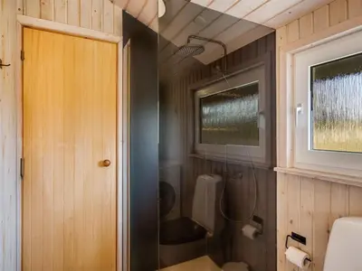 a bathroom with a shower and a toilet at Holiday Home Suleika - 900m from the sea by Interhome in Torsted