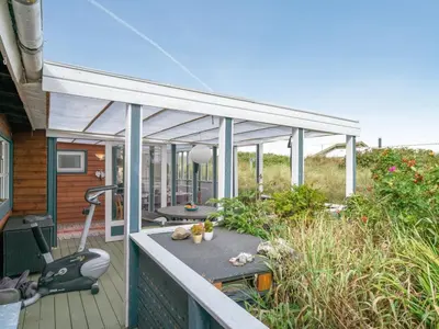 a screened in porch of a house at Holiday Home Stener - 250m from the sea by Interhome in Torsted