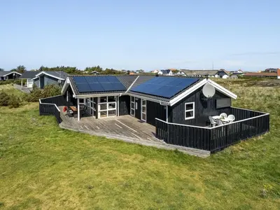 a house with solar panels on the roof at Holiday Home Emppu - 400m from the sea by Interhome in Torsted