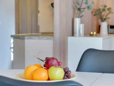 a plate of fruit sitting on a table at Holiday Home Afke - 900m from the sea by Interhome in Torsted