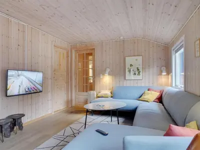 a living room with a couch and a table at Holiday Home Anegrete - 900m from the sea by Interhome in Torsted