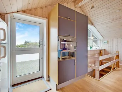 a small room with a door and a window at Holiday Home Viktorija - 800m from the sea by Interhome in Torsted