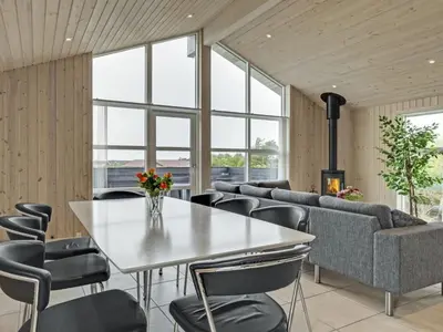 a dining room with a table and chairs at Holiday Home Mavis - 800m from the sea by Interhome in Torsted