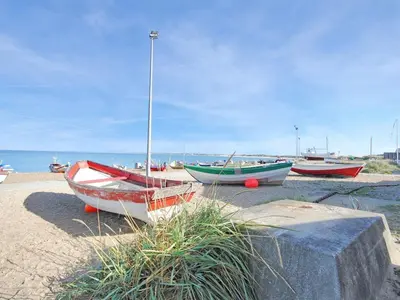 a group of boats sitting on the beach at Holiday Home Luzy - 600m from the sea by Interhome in Torsted