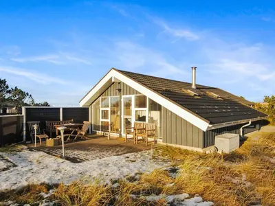 a small house with a solarium and a patio at Holiday Home Laurentia - 800m from the sea by Interhome in Torsted