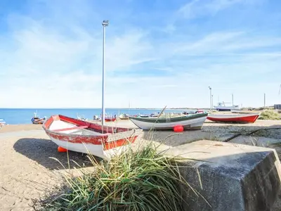 a group of boats sitting on the beach at Holiday Home Vivina - 250m from the sea by Interhome in Torsted