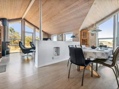 a dining room with a table and chairs at Holiday Home Øde - 350m from the sea by Interhome in Torsted