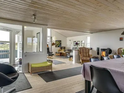 a living room with a table and chairs at Holiday Home Fabiana - 350m from the sea by Interhome in Torsted