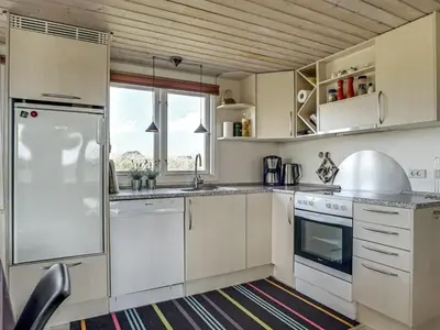 a kitchen with white cabinets and a sink at Holiday Home Fabiana - 350m from the sea by Interhome in Torsted