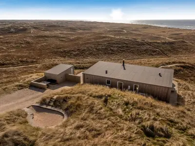 an aerial view of a building in a field at Holiday Home Ginne - 125m from the sea by Interhome in Torsted
