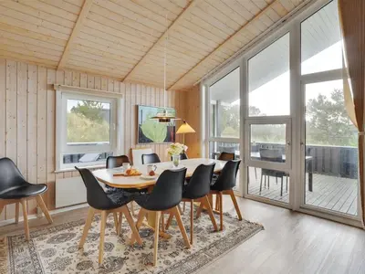 a dining room with a table and chairs at Holiday Home Rosali - 500m from the sea by Interhome in Torsted