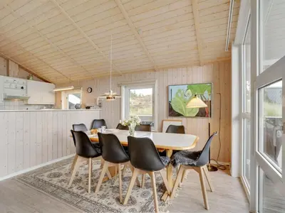 a dining room with a table and chairs at Holiday Home Rosali - 500m from the sea by Interhome in Torsted