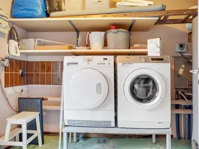 a laundry room with a washer and dryer at Holiday Home Fridolina - 200m from the sea by Interhome in Torsted
