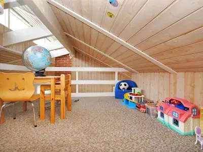 a childs room with a table and a toy train at Holiday Home Dode - 225m from the sea by Interhome in Torsted