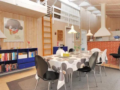 a dining room with a table and chairs at Holiday Home Dode - 225m from the sea by Interhome in Torsted
