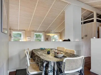 a dining room with a table and chairs at Holiday Home Tino - 900m from the sea by Interhome in Torsted