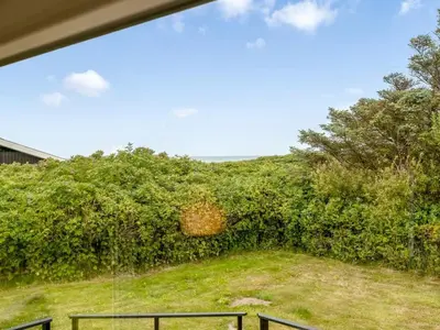 a view of a yard from a house at Holiday Home Bengta - 200m from the sea by Interhome in Løkken