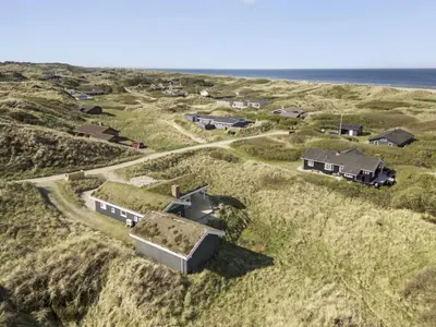 an aerial view of a house on the beach at Holiday Home Solvejg - 150m from the sea by Interhome in Løkken